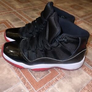 Jordan 11 Retro“Bred “Size 7 ( PRICE NEGOTIABLE) Will be cleaned before shipped!